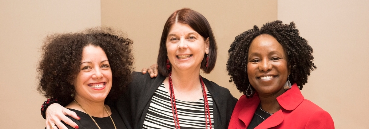 President Lisa Freeman with two SPS employees.